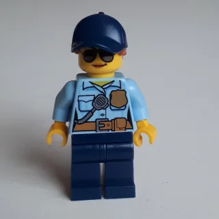 Policewoman Sam Solo, Bright Light Blue Shirt with Radio and Badge, Dark Blue Legs, Dark Blue Cap with Hair, Sunglasses